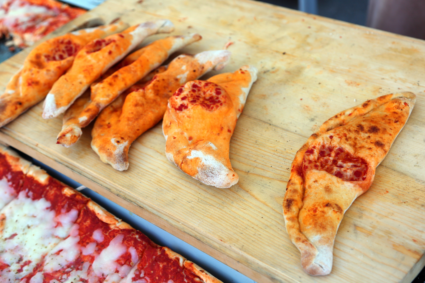 Eat a calzone in Milano, Italy.
