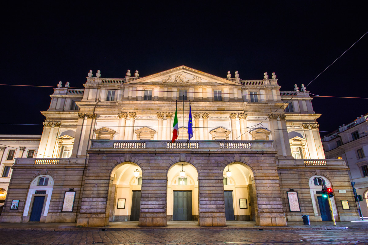 The Teatro alla Scala offers stunning views of ornate gold and red.